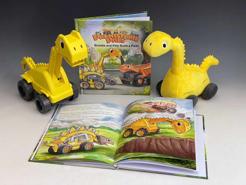 Prehistoric-Pals-book-open-and-closed-with-plastic-and-plush-Brontie-construction-dinosaur-truck-and-excavator-toys