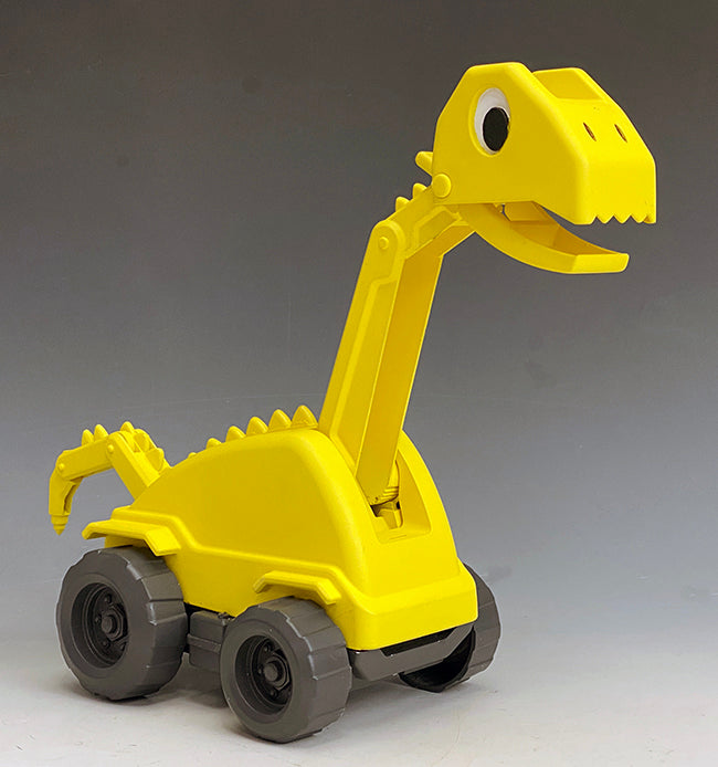 Brontie is the main character from the Prehistoric Pals book. This is a front three quarter view of the yellow colored dinosaur. He has big eyes and a happy face.  Kids can move his mouth open and close with one finger, to mimic talking or to use for digging. Give your little one a pal to cherish! Prehistoric Pals dinosaur toys & books teach friendship, respect, and the importance of developing personal values.