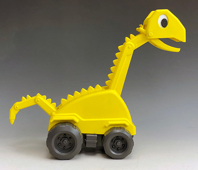 This is the side view of Brontie the dinosaur. His neck articulated down to the ground for digging and his jack hammer tail articulates in three places and is use for loosening up the soil or hard surfaces before digging.
