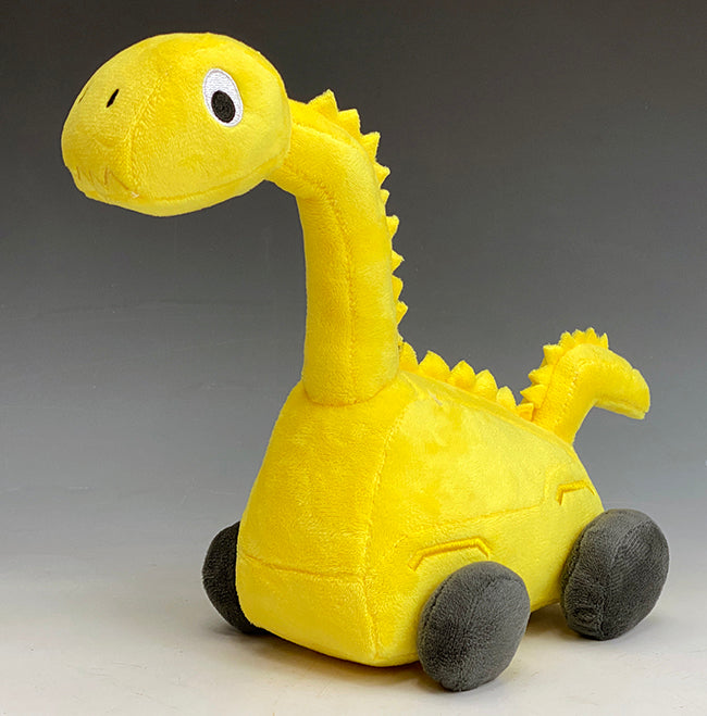 This cute yellow Plush Brontie Dinosaur is a combination Brontosaurus and construction Excavator toy. The three-quarter view of the stuffed animal toy shows his big eyes and happy face. Give your little one a pal to cherish! Prehistoric Pals dinosaur toys & books teach friendship, respect, and the importance of developing personal values.